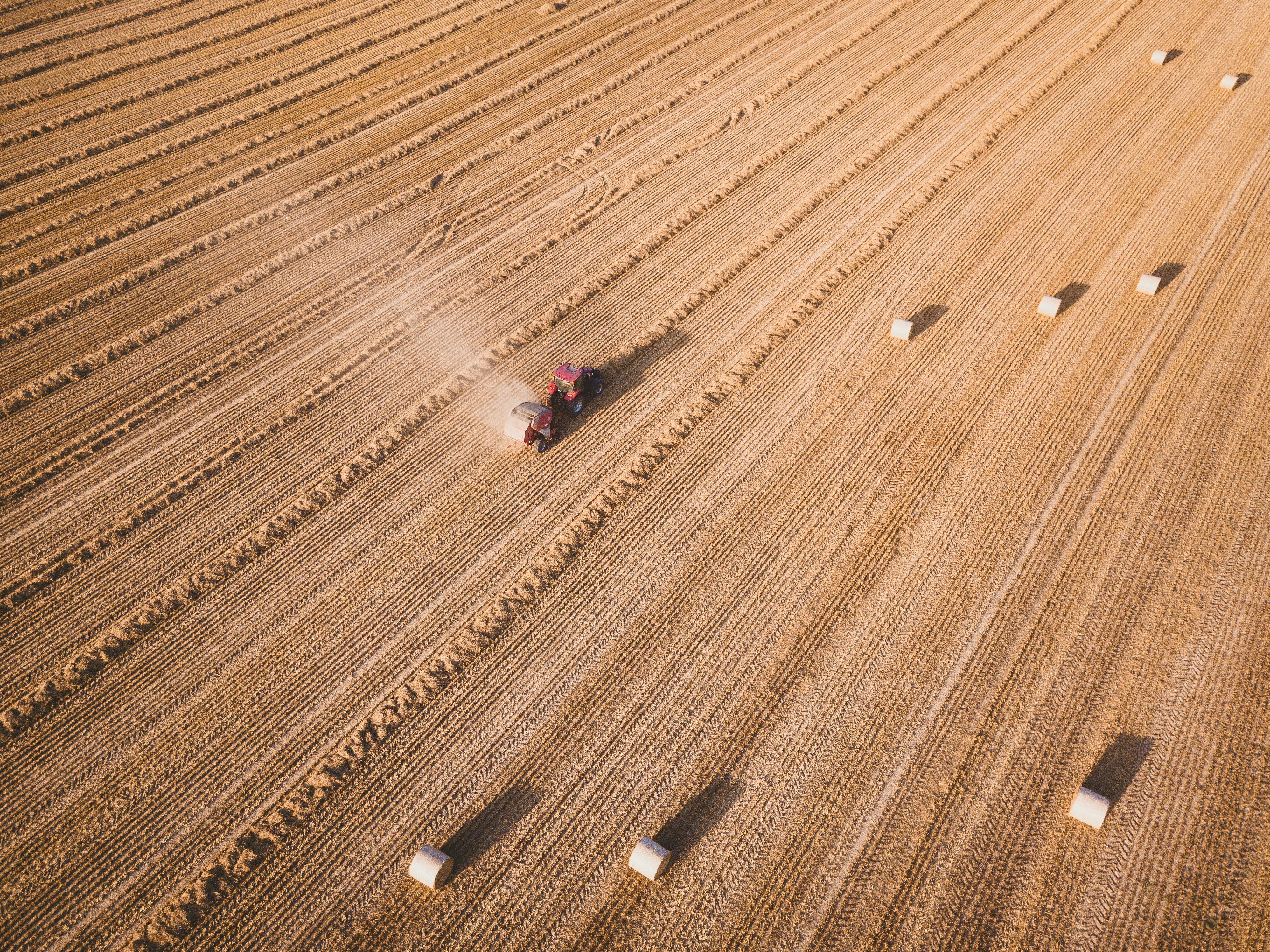 farming equipment on soil field during day